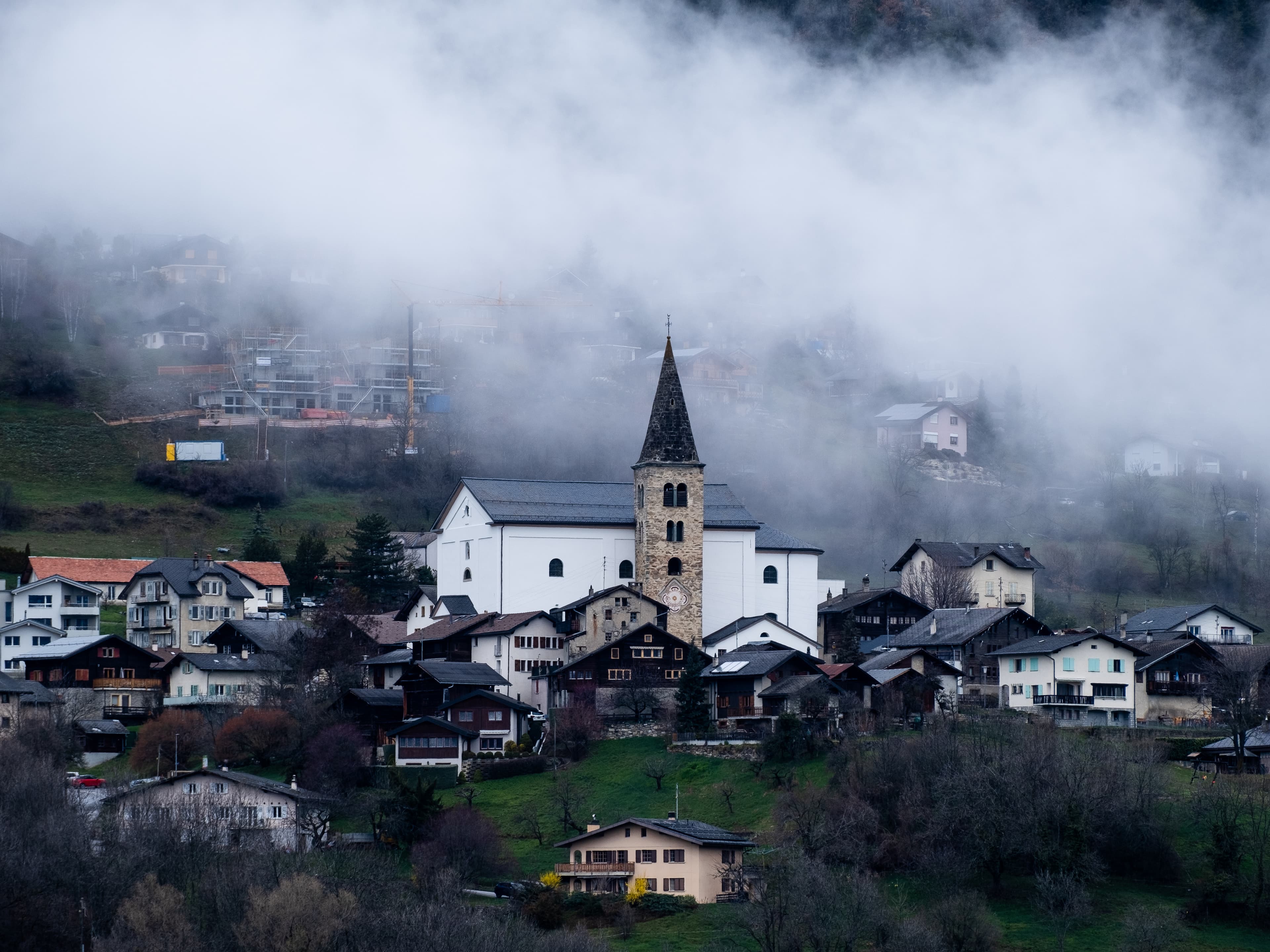 Saint-Romain church with bell tower and surroundings
