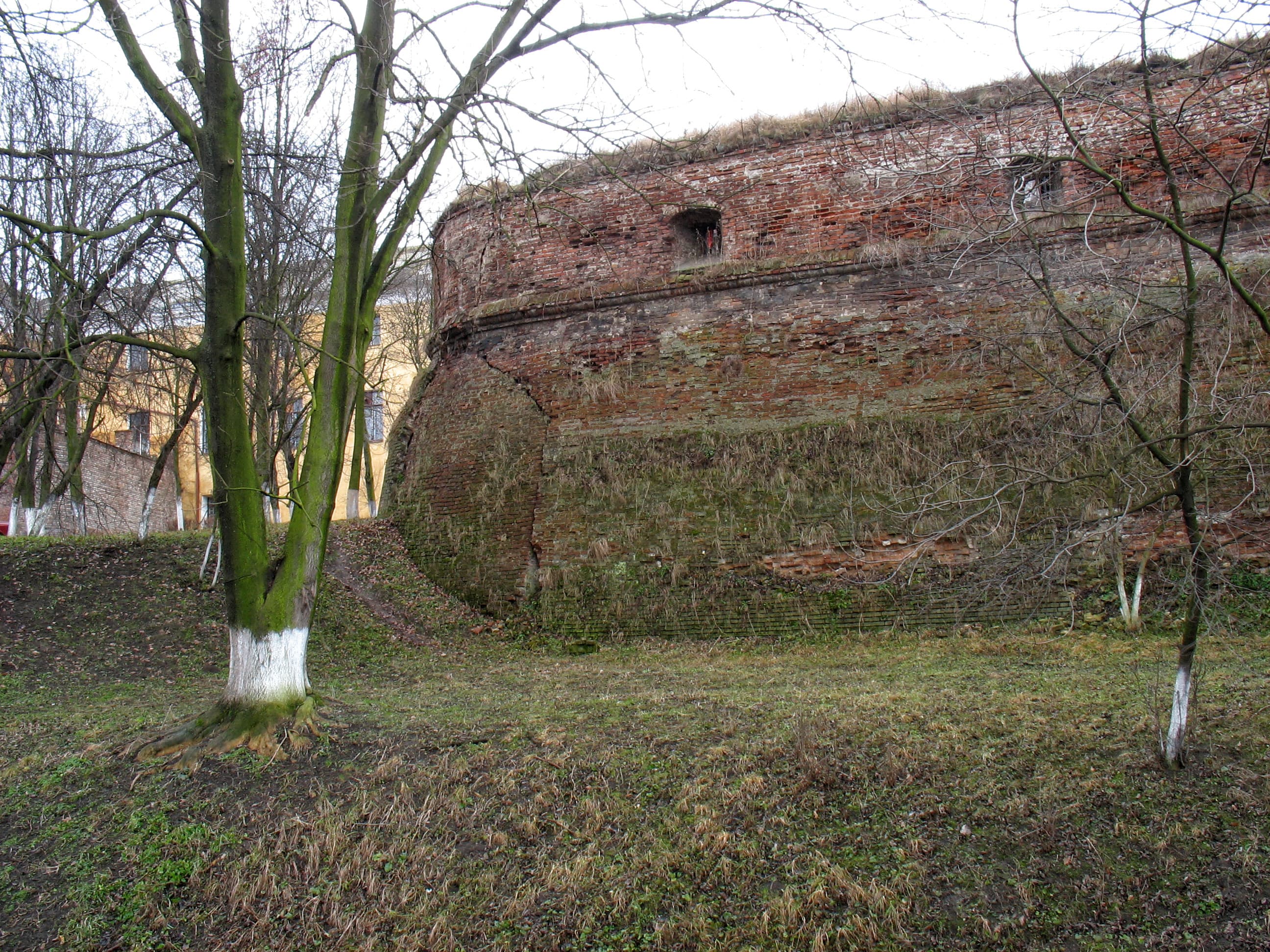 Walls with towers and gates in Holy Trinity church (catholic), Olyka