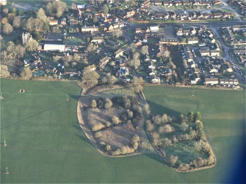 Moated manorial complex and church site 230m south east of All Saints' Church