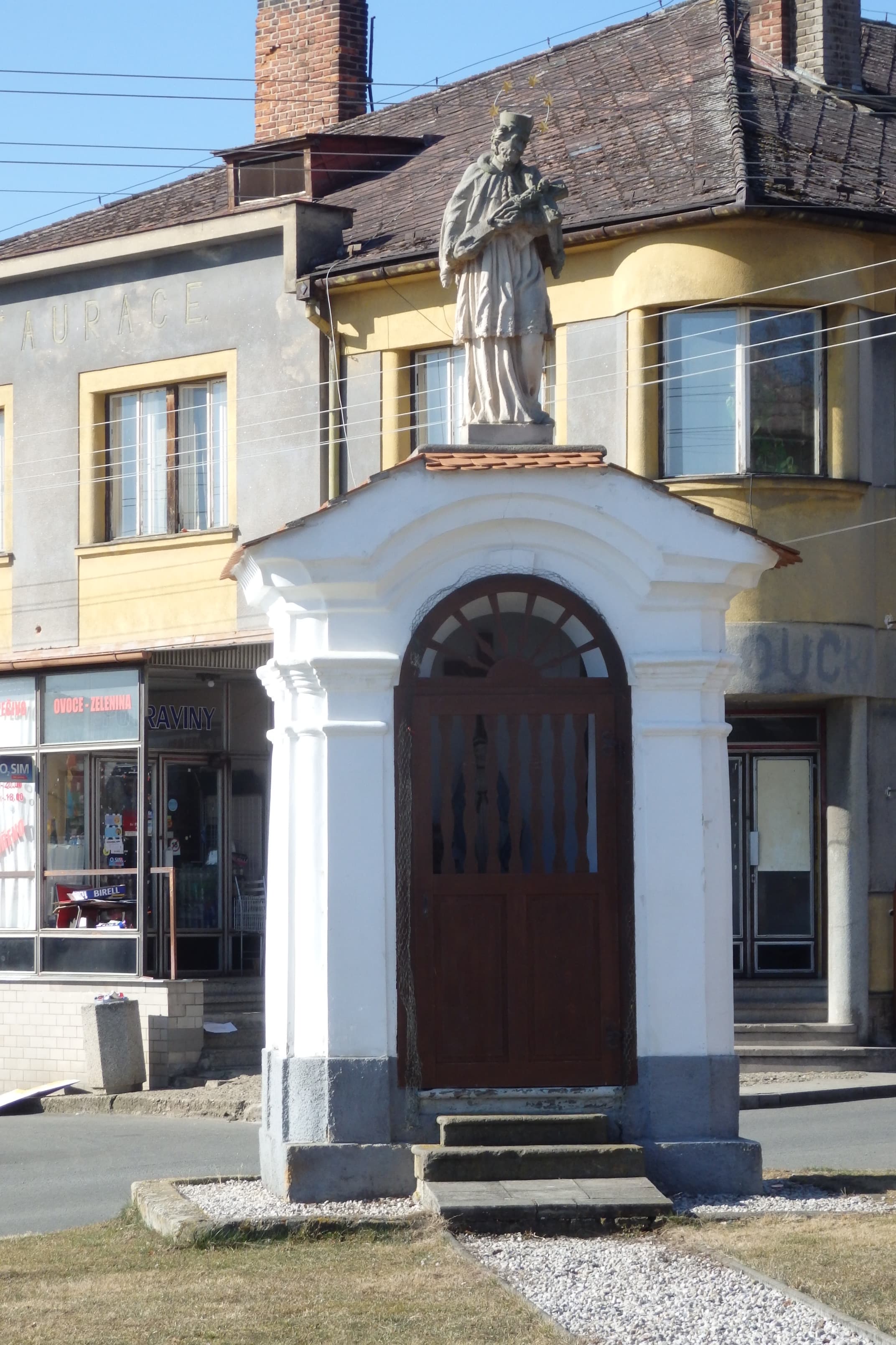 Chapel-shrine with a statue of John of Nepomuk in Drozdov